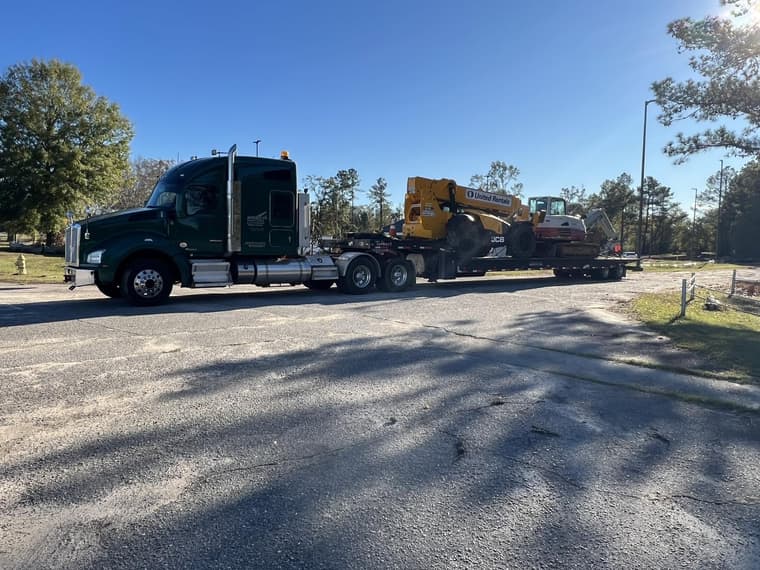 Excavator on a lowboy trailer